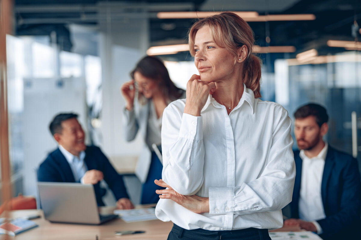 Management and leadership image of a confident female with colleagues